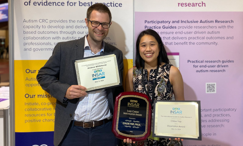 Dr Chloe Yap and Professor Andrew Whitehouse holding their awards