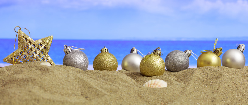 Christmas ornaments on a beach