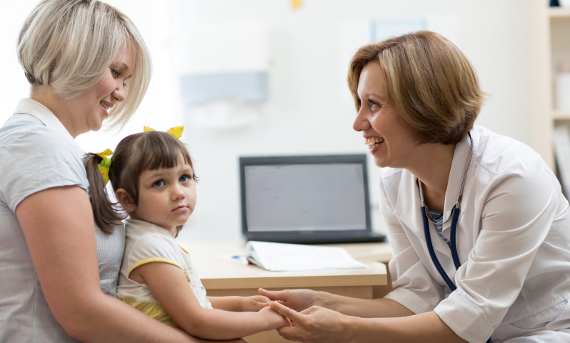 A young child, the child's parent, and a doctor