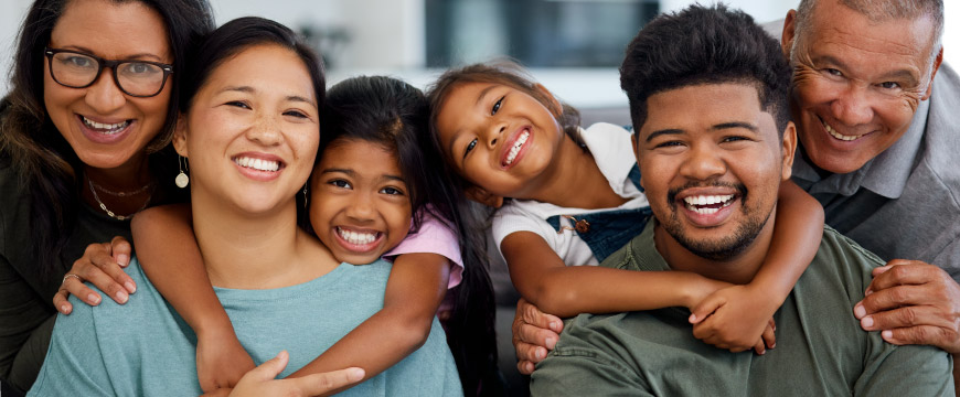 A New Zealand family embracing each other